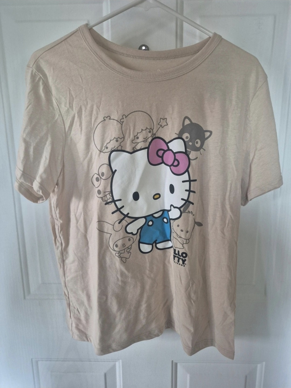 Hello Kitty Short Sleeve Tee in Beige with Pink Bow and Blue Overalls